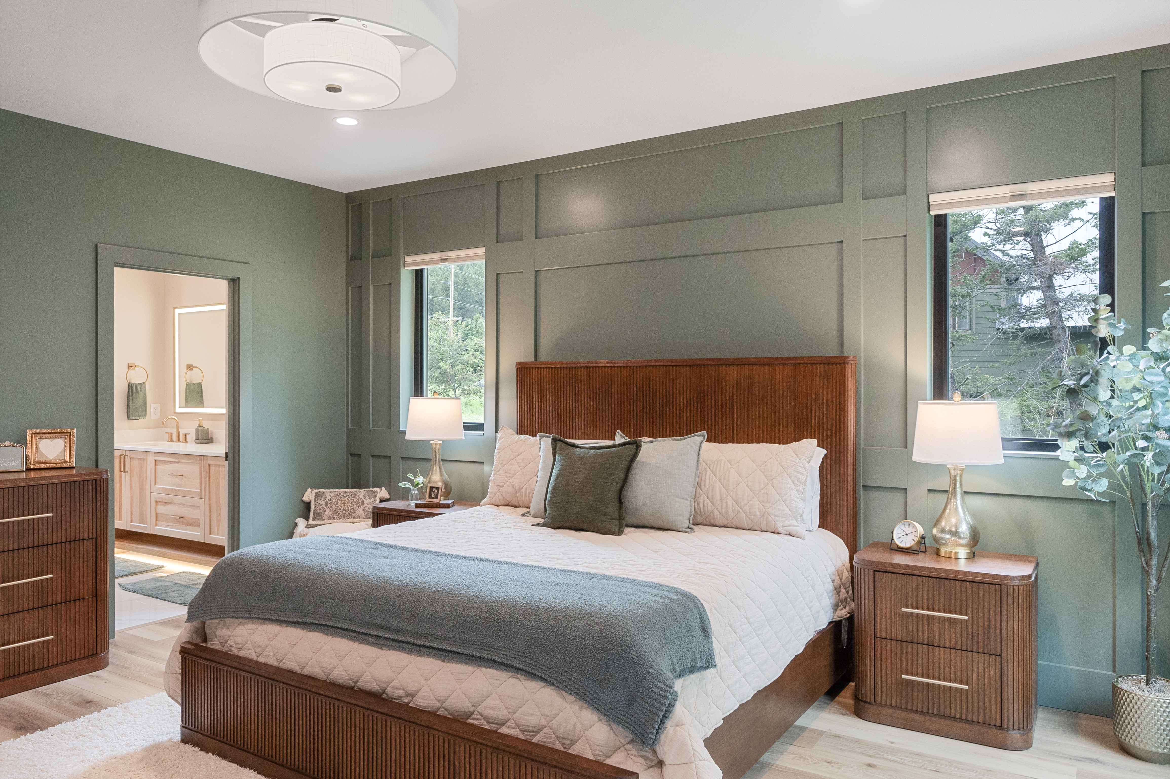Master Suite 2 with fireplace and forest views