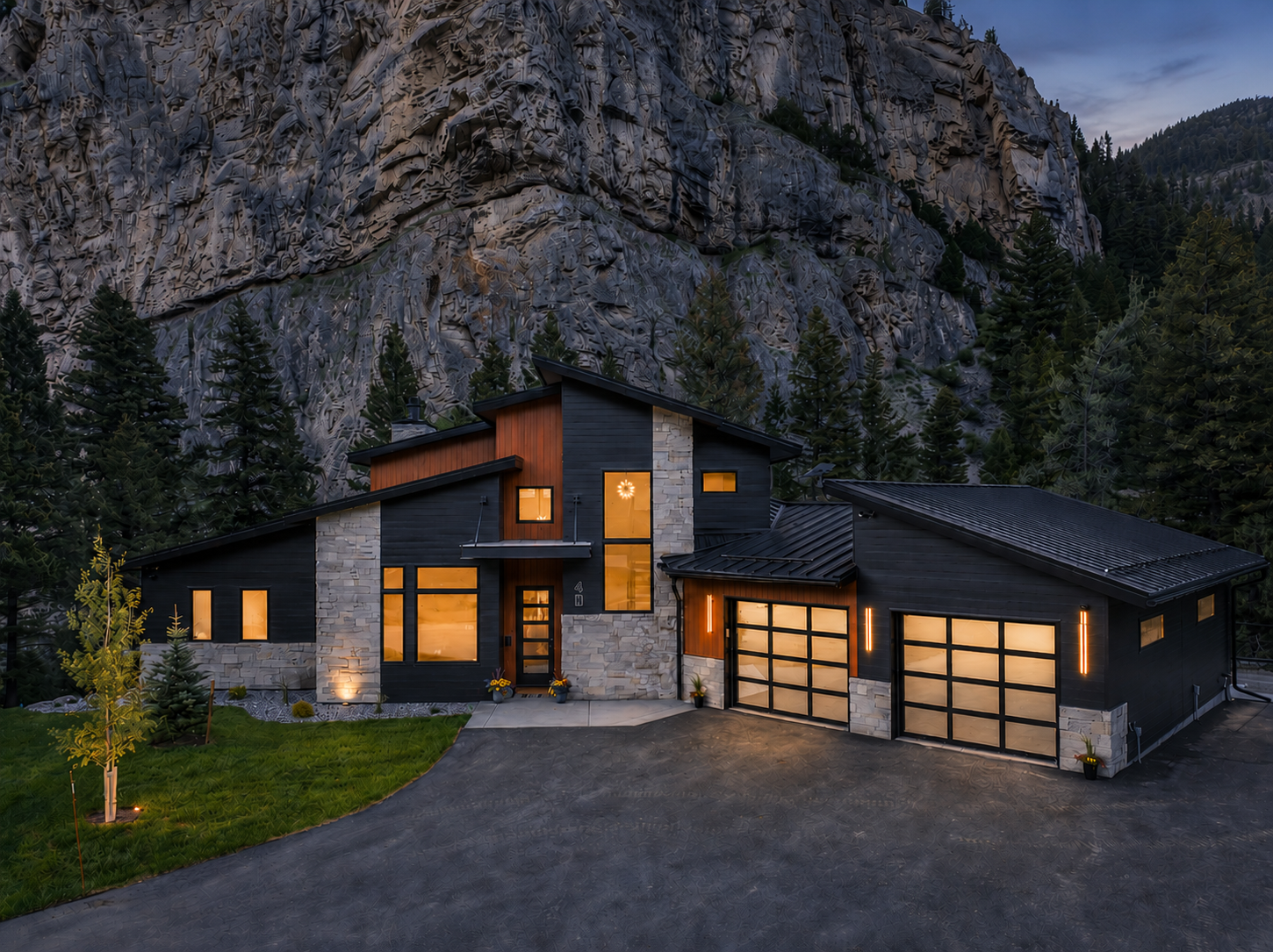 Front exterior at night with warm glowing windows